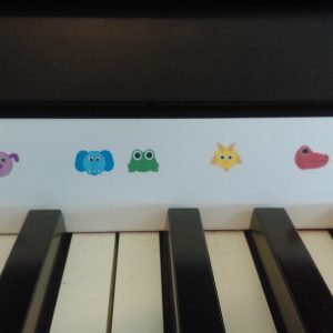 Animal stickers in front of the piano keys