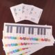 A number of Piano Cards having colorful animal stickers
