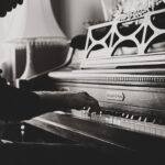 Black and white image of a man playing piano
